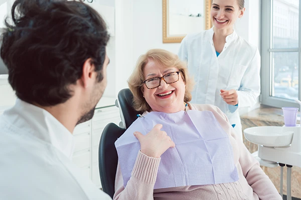 Dental team consulting a patient