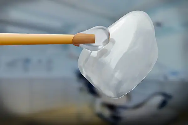  A dental veneer being gently brushed 